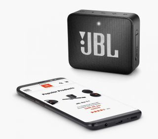 Small black wireless speaker with JBL logo