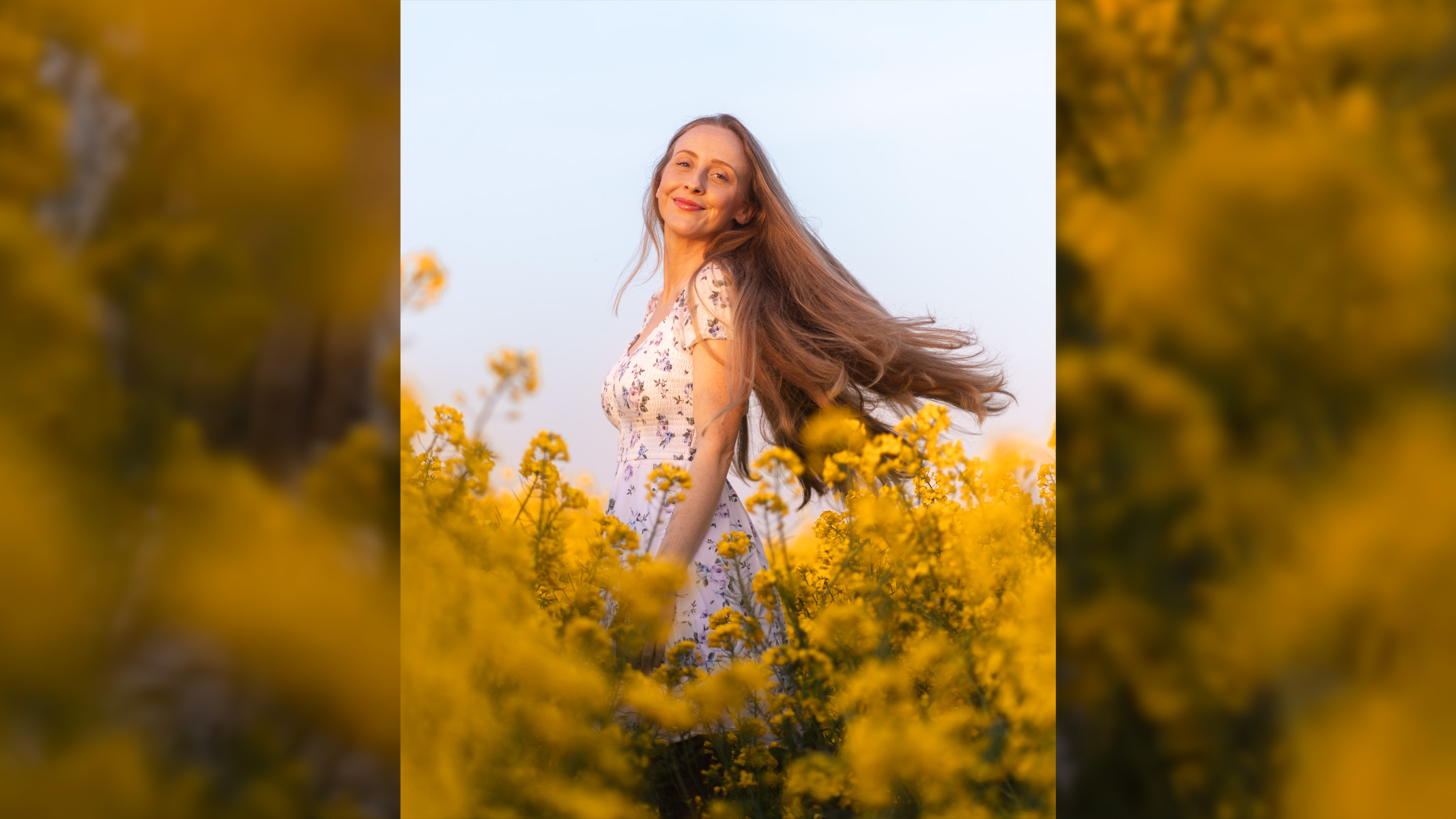 woman with long hair in a rapeseed field