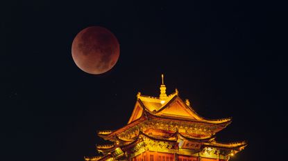 A photograph of the "blood moon" above Jiujiang in China.