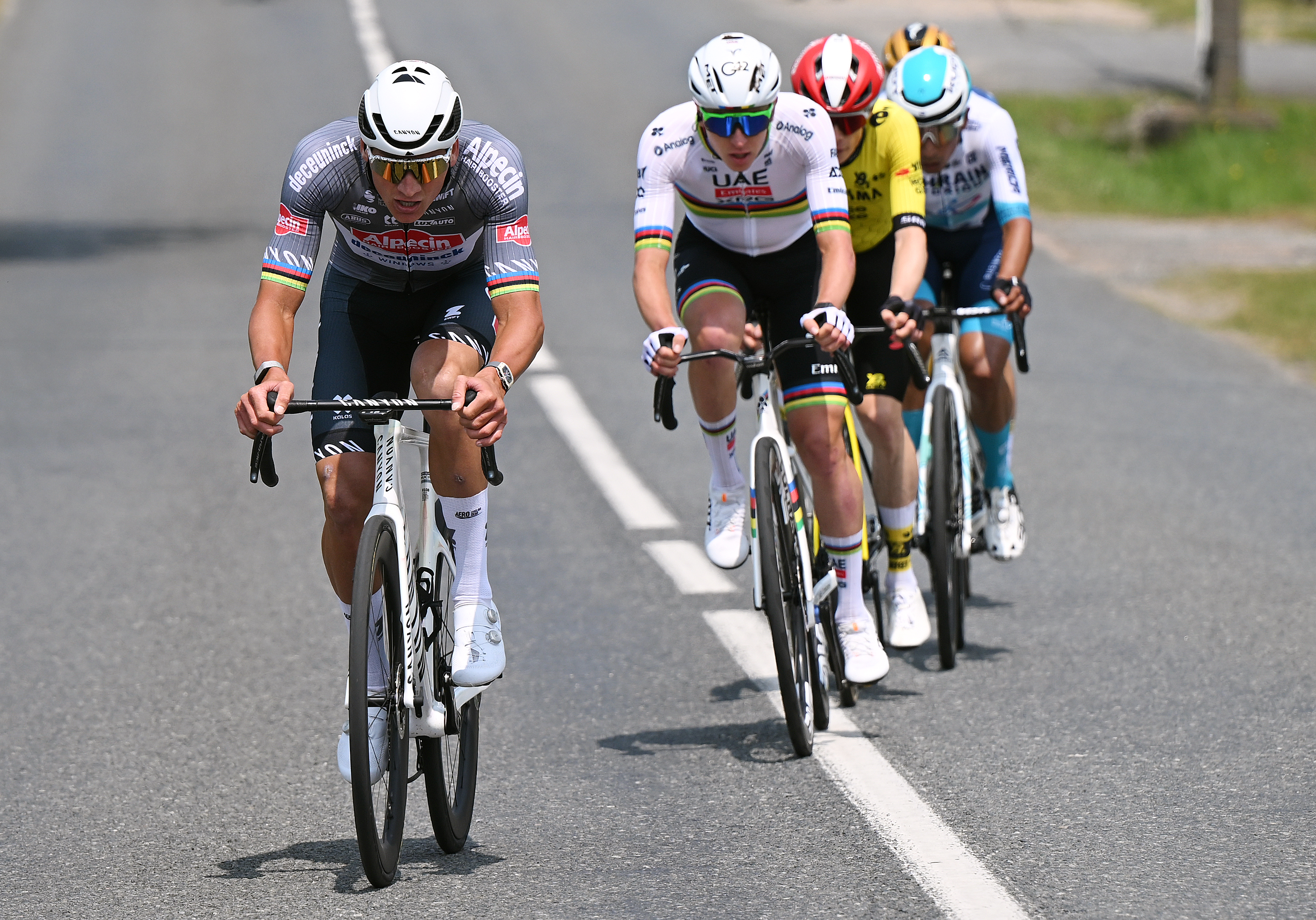 MONTLUCON, FRANCE - JUNE 08: (L-R) Mathieu van der Poel of Netherlands and Team Alpecin - Deceuninck, Tadej Pogacar of Slovenia and UAE Team Emirates - XRG, Jonas Vingegaard of Denmark and Team Visma | Lease a Bike compete in the breakaway during the 77th Criterium du Dauphine 2025, Stage 1 a 195.8km stage from Domerat to Montlucon / #UCIWT / on June 08, 2025 in Montlucon, France. (Photo by Dario Belingheri/Getty Images)