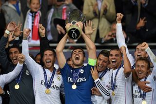 Real Madrid captain Iker Casillas lifts the trophy after winning the Super Cup final in Cardiff