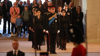 LONDON, ENGLAND - SEPTEMBER 17: Prince William, Prince of Wales, Prince Harry, Duke of Sussex, Princess Eugenie of York, Princess Beatrice of York, Peter Phillips, Zara Tindall, Lady Louise Windsor, James, Viscount Severn (obscured) arrive to hold a vigil in honour of Queen Elizabeth II at Westminster Hall on September 17, 2022 in London, England. Queen Elizabeth II's grandchildren mount a family vigil over her coffin lying in state in Westminster Hall. Queen Elizabeth II died at Balmoral Castle in Scotland on September 8, 2022, and is succeeded by her eldest son, King Charles III.
