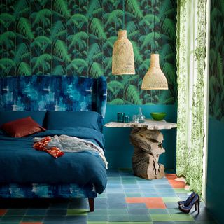 bedroom with green designed wall blue designed bed and blue tile flooring
