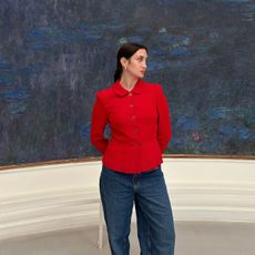 Who What Wear associate beauty editor Alyssa Brascia posing in front of a Claude Monet painting.