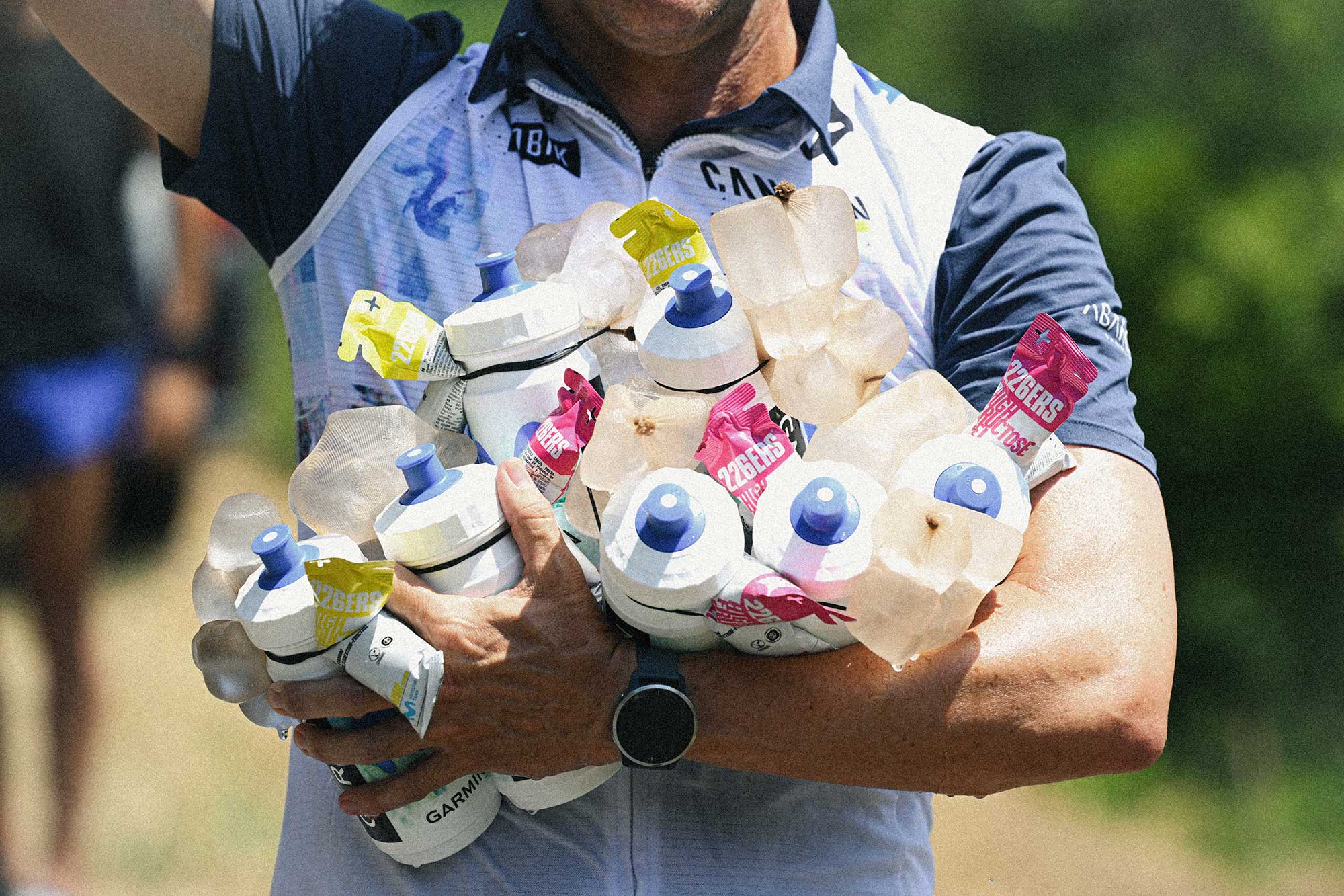 A Team soigneur provides bidons and ice to rider during stage 6 of the Tour de France 2026 (Photo by Dario Belingheri/Getty Images)