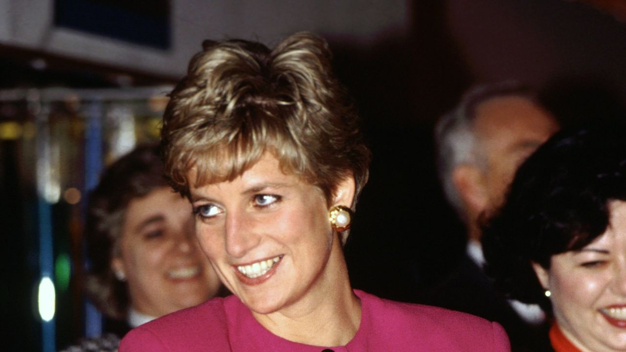 CANADA - OCTOBER 24: Diana, Princess of Wales, smiling during her visit to Sudbury, part of her official tour of Canada, The Princess is wearing a pink suit designed by fashion designer Paul Costelloe (Photo by Tim Graham Photo Library via Getty Images)