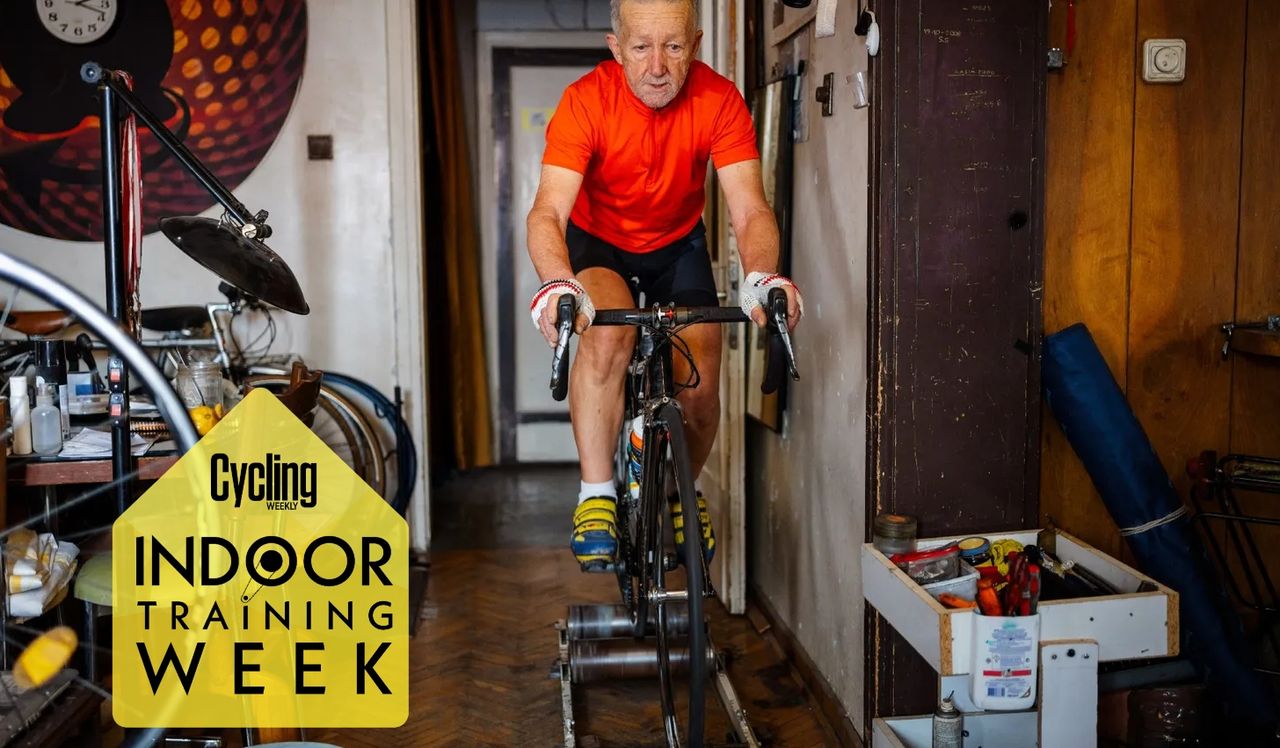 Elderly man cycling on rollers indoors