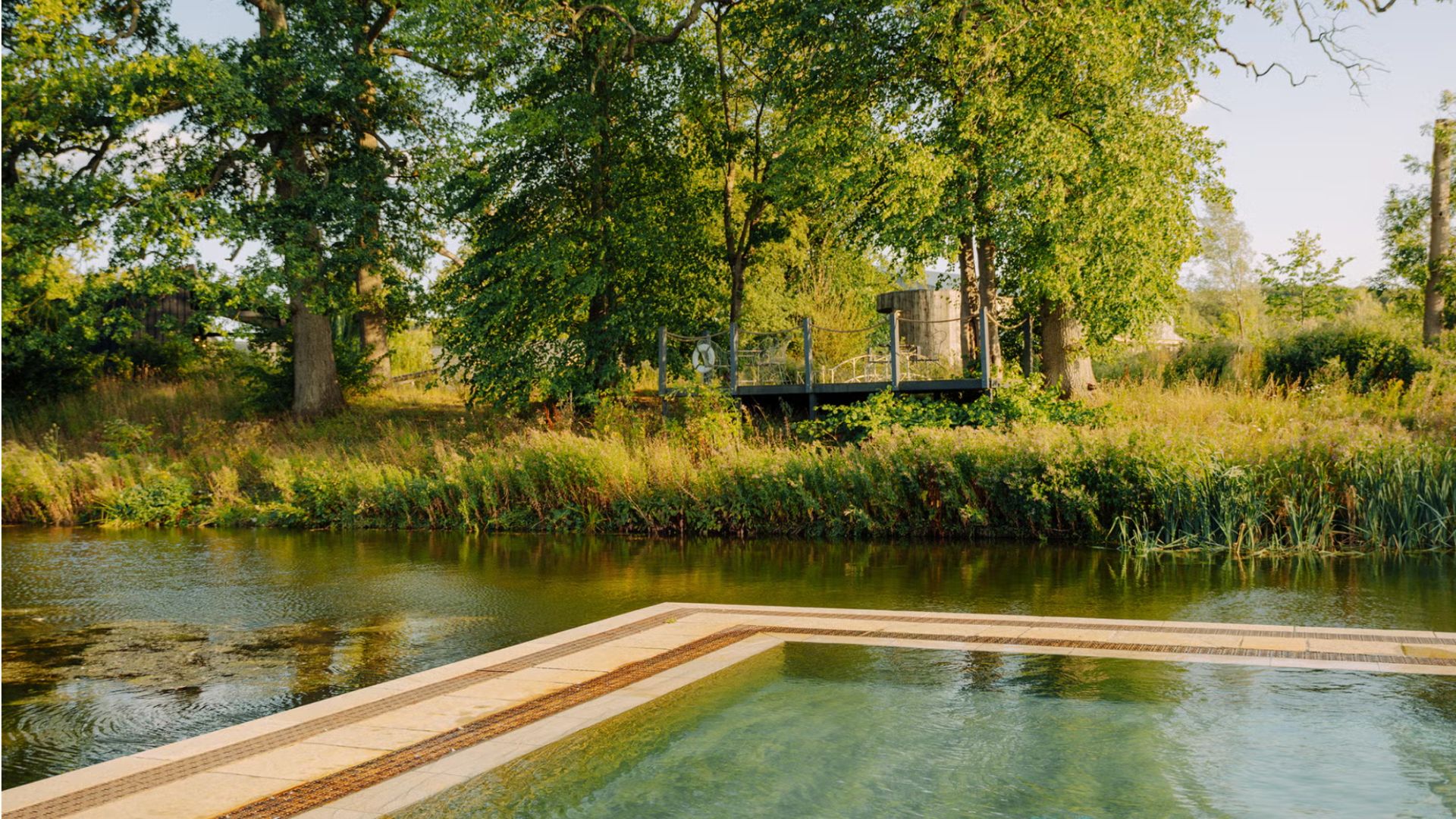 an image of the natural pool at Soho Farmhouse in the Cotswolds