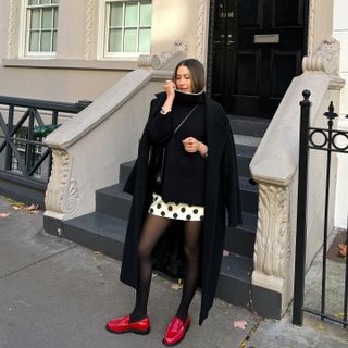 Fashion influencer @trendingwithtinsley wearing a chic long wool winter coat.