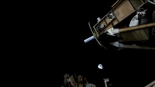 A SpaceX Dragon cargo ship is seen approaching the International Space Station to deliver tons of supplies along with Christmas gifts and food for astronauts as part of NASA's CRS-24 cargo mission on Dec. 22, 2021.