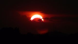 Setting sun eclipsed in Tulsa, Oklahoma.