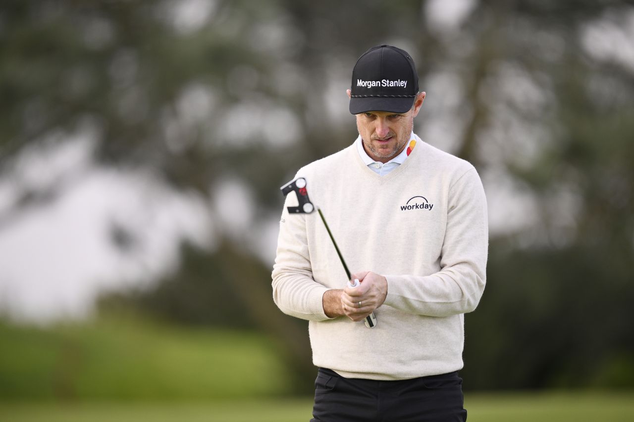 Justin Rose lines up a putt
