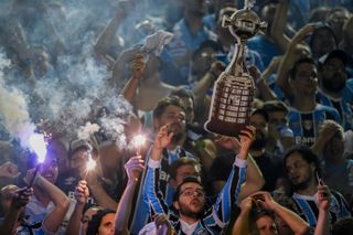 Gremio players celebrate with the trophy after winning the Copa Libertadores in November 2017.