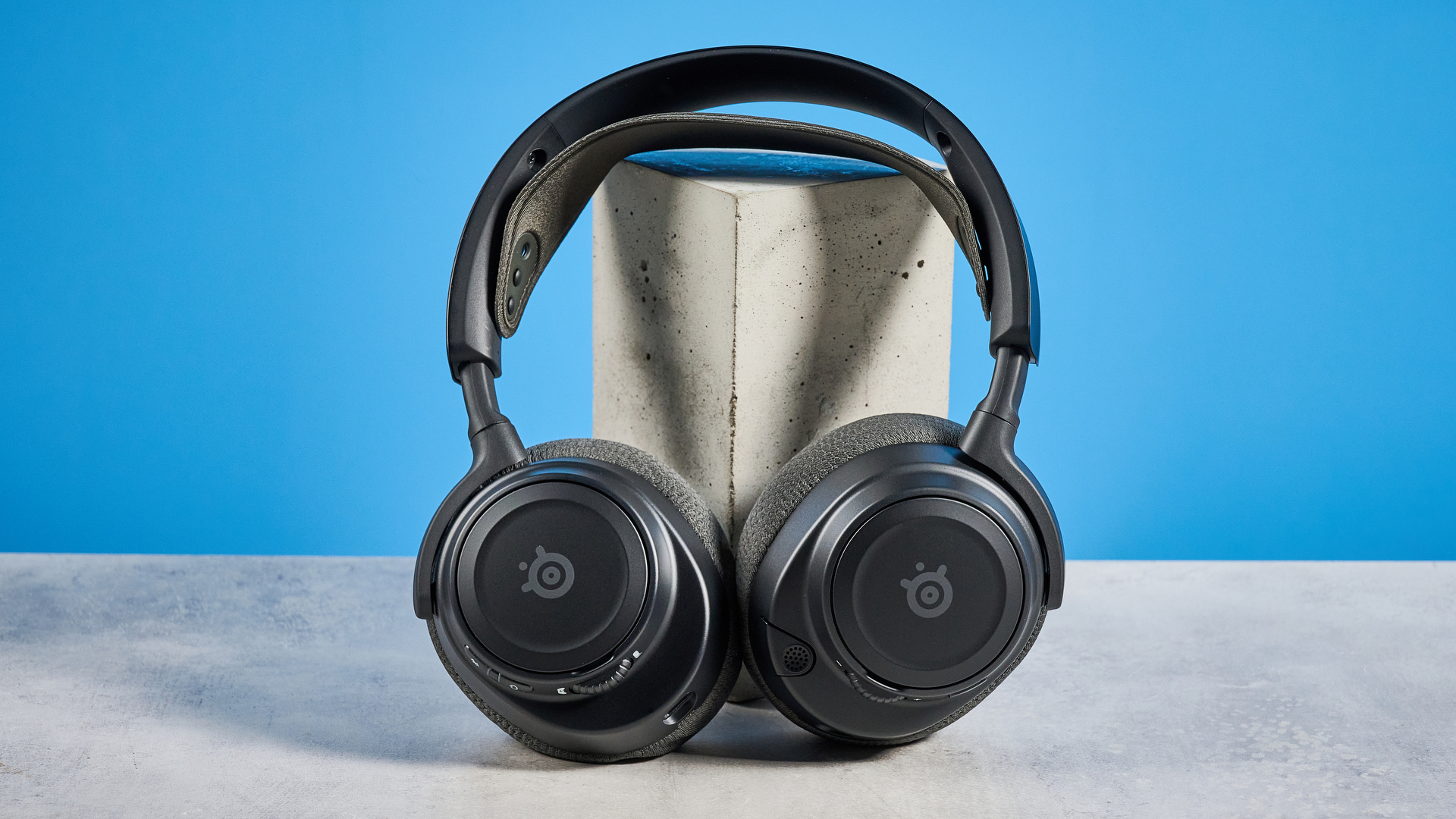 The SteelSeries Arctis Nova 7 Gen 2 against a blue background