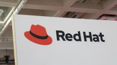 Red Hat logo and branding pictured on a vendor stall at the Databricks Data + AI Summit in San Francisco, California.