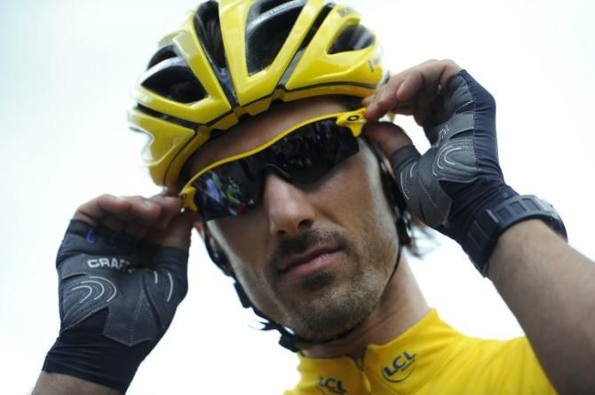 Tour de France prologue winner Fabian Cancellara resplendent in yellow at the start of the first road stage.