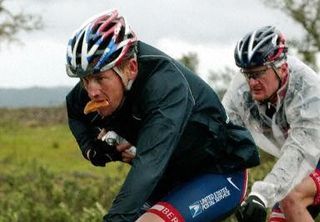 Armstrong and Landis ride together in 2004