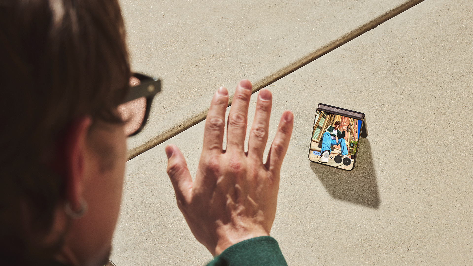 Motorola Razr 70 Ultra placed on ground to demonstrate video chat using outer display