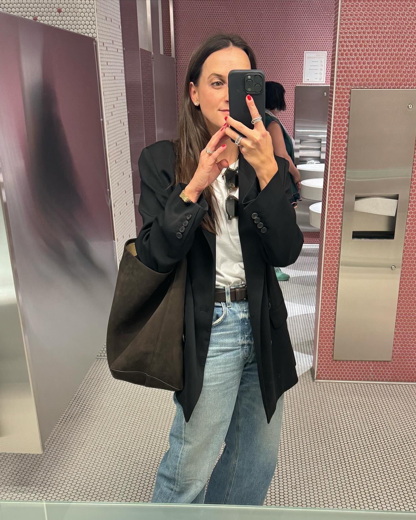 Influencer wearing brown The Row park tote.