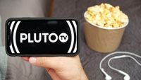 Pluto TV on a phone with popcorn nearby