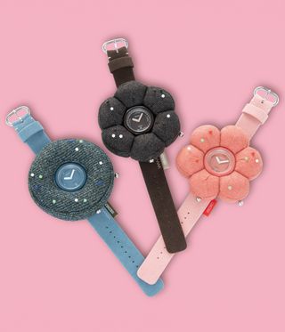 Flower-shaped Seiko watches on coloured background