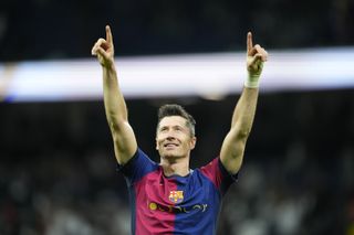 Robert Lewandowski celebrates victory for Barcelona against Real Madrid at the Santiago Bernabeu in October 2024.