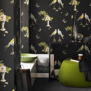 room with black wallpaper and green bowl