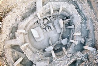 In Göbekli Tepe, archeologists have uncovered a handful of circular neolithic structures such as this one (Enclosure C), which consist of two T-shaped pillars surrounded by a bunch of slightly smaller inward-facing pillars.