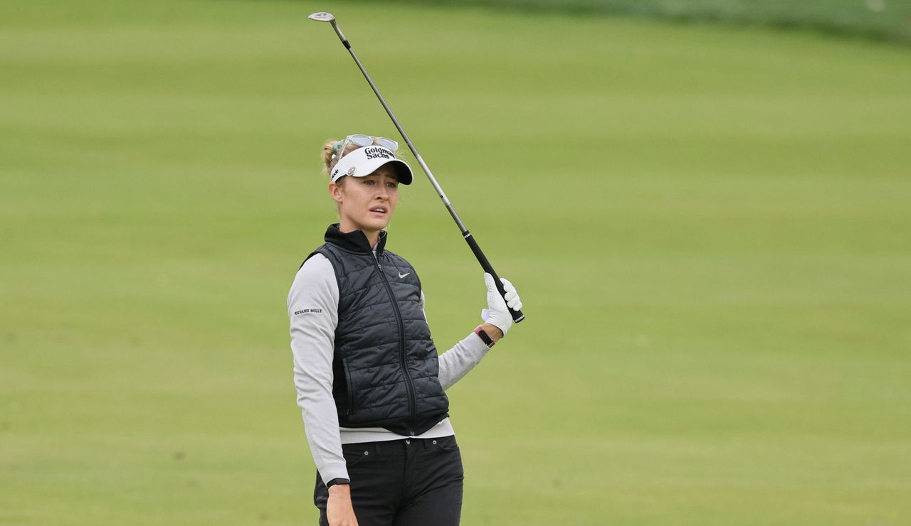 Nelly Korda watches her shot whilst taking her hand off the club