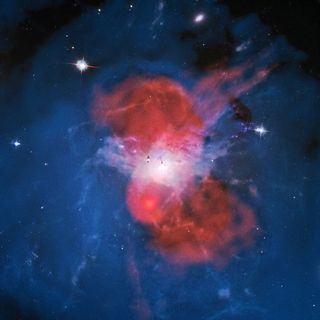 Composite image of the center of the Perseus galaxy cluster. Red is the radio emission received by LOFAR. Blue is X-rays by the Chandra telescope. White is hydrogen from the H-alpha map of the WIYN telescope. And the background is the night sky in optical light from the Hubble telescope.