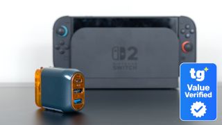 The Genki Covert Dock 3 in front of an official Switch 2 dock with a Tom's Guide Value Verified Savings Squad badge