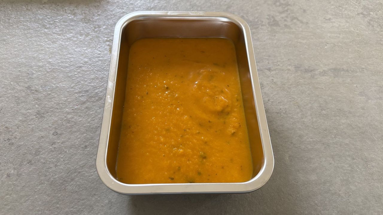 One of the IKEA Stainless Steel Food Containers with soup in