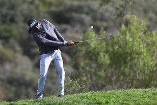 Sahith Theegala hits from the rough at Torrey Pines