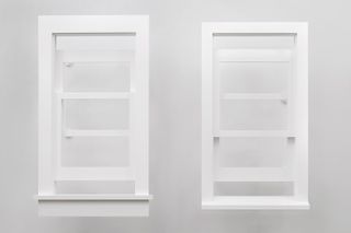Both sides of a white coloured window.