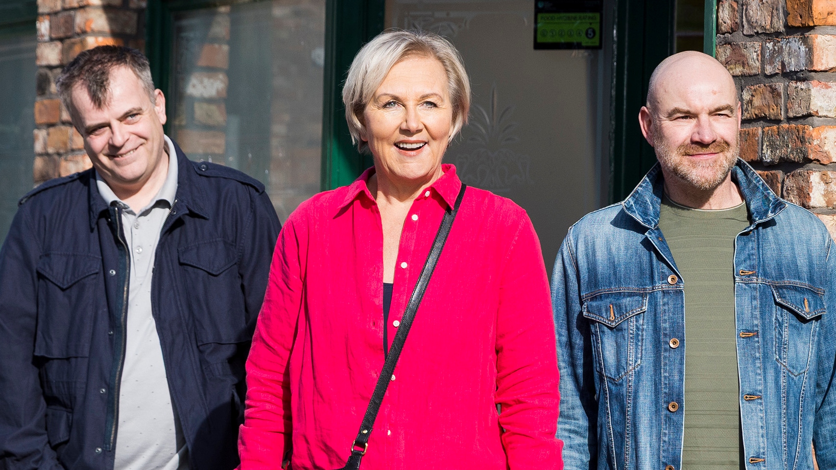Eileen flanked by Steve and Tim outside the Rovers