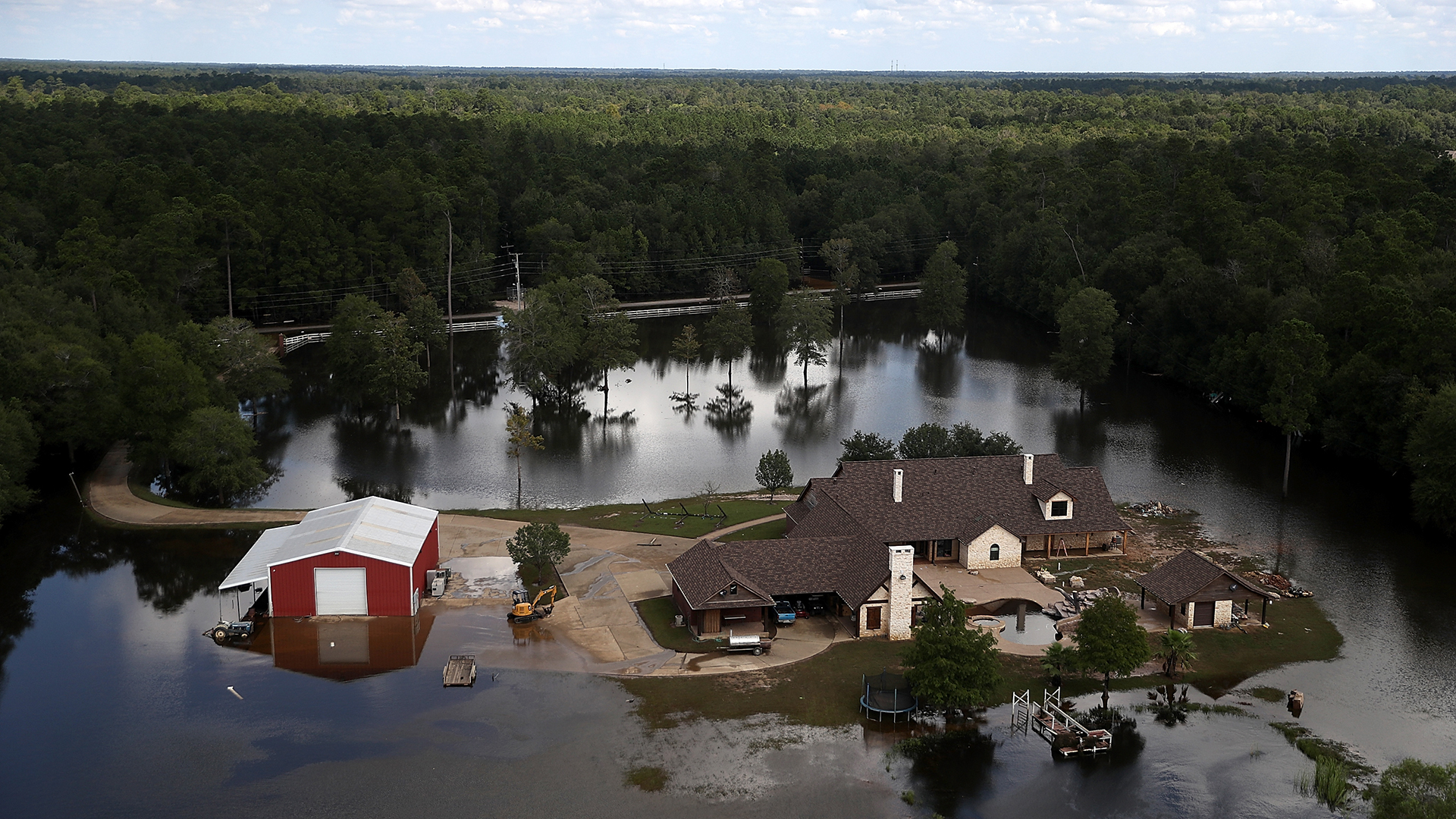A home near Beaumont, Texas surrounded by flood waters on September 5, 2017 following Hurricane Harvey.