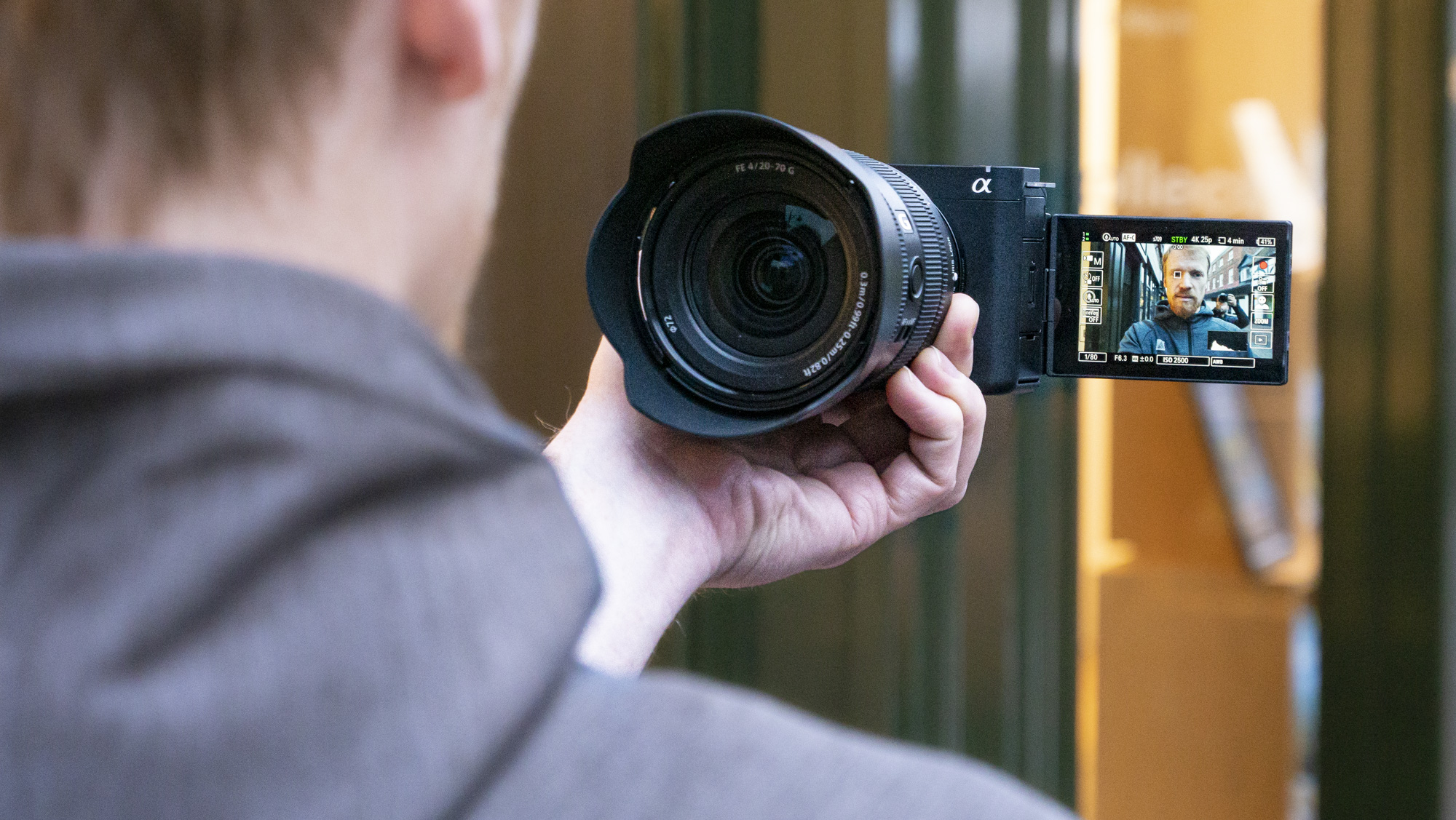 An hand holding the Sony ZV-E1 camera