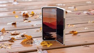 The Samsung Galaxy Z Fold 4 with Samsung's S Pen case set amongst an Autumn backdrop