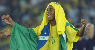 Brazilian midfielder Ronaldinho celebrates the victory of his team, 30 June 2002 in Yokohama, Japan, after the final of the 2002 FIFA World Cup between Brazil and Germany. Brazil won the final 2-0. AFP PHOTO - Patrick HERTZOG