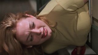 Rose McGowan as Tatum Riley in a doggy door in Scream