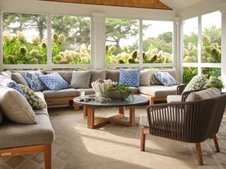 sunroom ideas with lots of cushions and blue hydrangeas