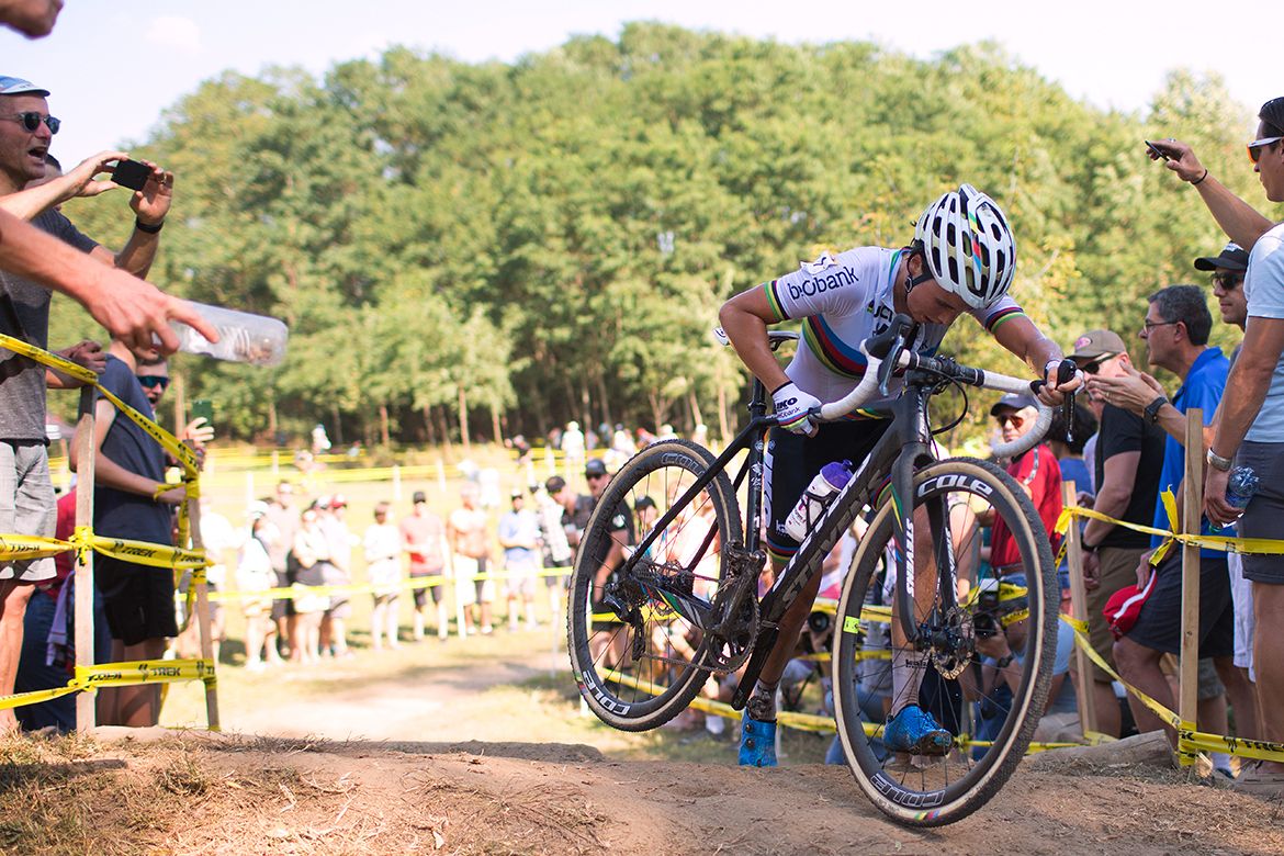 World champion Sanne Cant carrying her bike