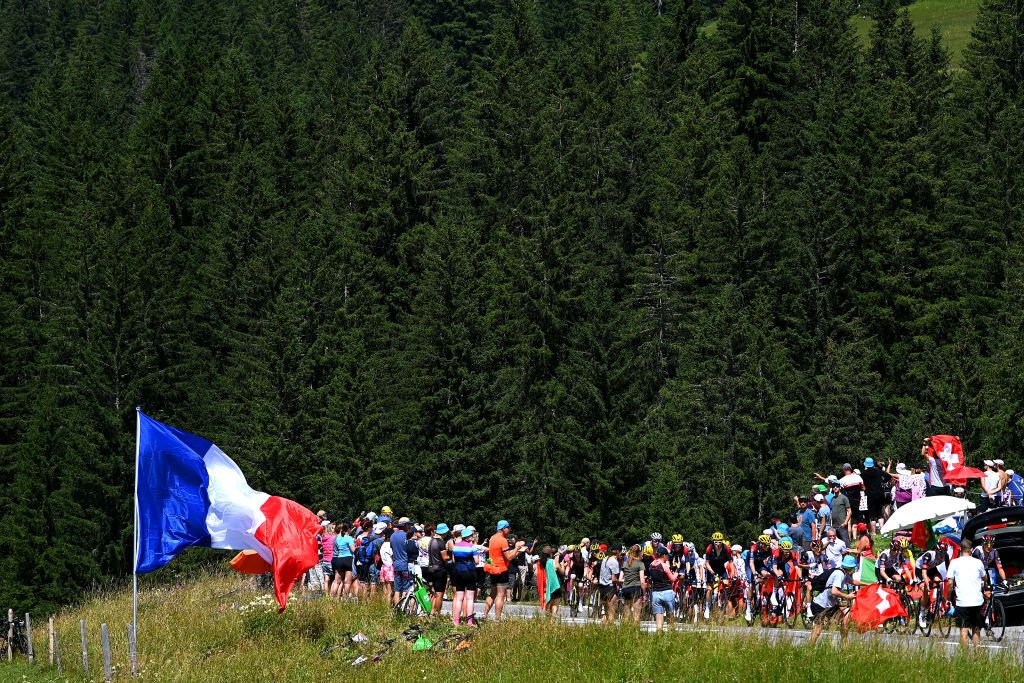 CHTEL LES PORTES DU SOLEIL FRANCE JULY 10 Geraint Thomas of The United Kingdom Thomas Pidcock of United Kingdom and Team INEOS Grenadiers White Best Young Rider Jersey and a general view of the peloton competing while fans cheer during the 109th Tour de France 2022 Stage 9 a 1929km stage from Aigle to Chtel les portes du Soleil 1299m TDF2022 WorldTour on July 10 2022 in Chtel les portes du Soleil France Photo by Tim de WaeleGetty Images