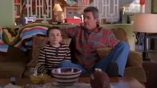 Atticus Shaffer as Brick and Neil Flynn as Mike watching football on The Middle