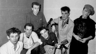 The Pogues posing for a photograph in 1984