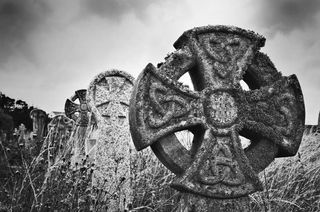 Celtic cross in graveyard.