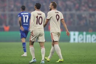 Bayern Munich's German forward #10 Leroy Sane celebrates scoring the 8-2 goal with his teammate Bayern Munich's English forward #09 Harry Kane during the UEFA Champions League football match FC Bayern Munich vs GNK Dinamo Zagreb in Munich, southern Germany, on September 17, 2024.