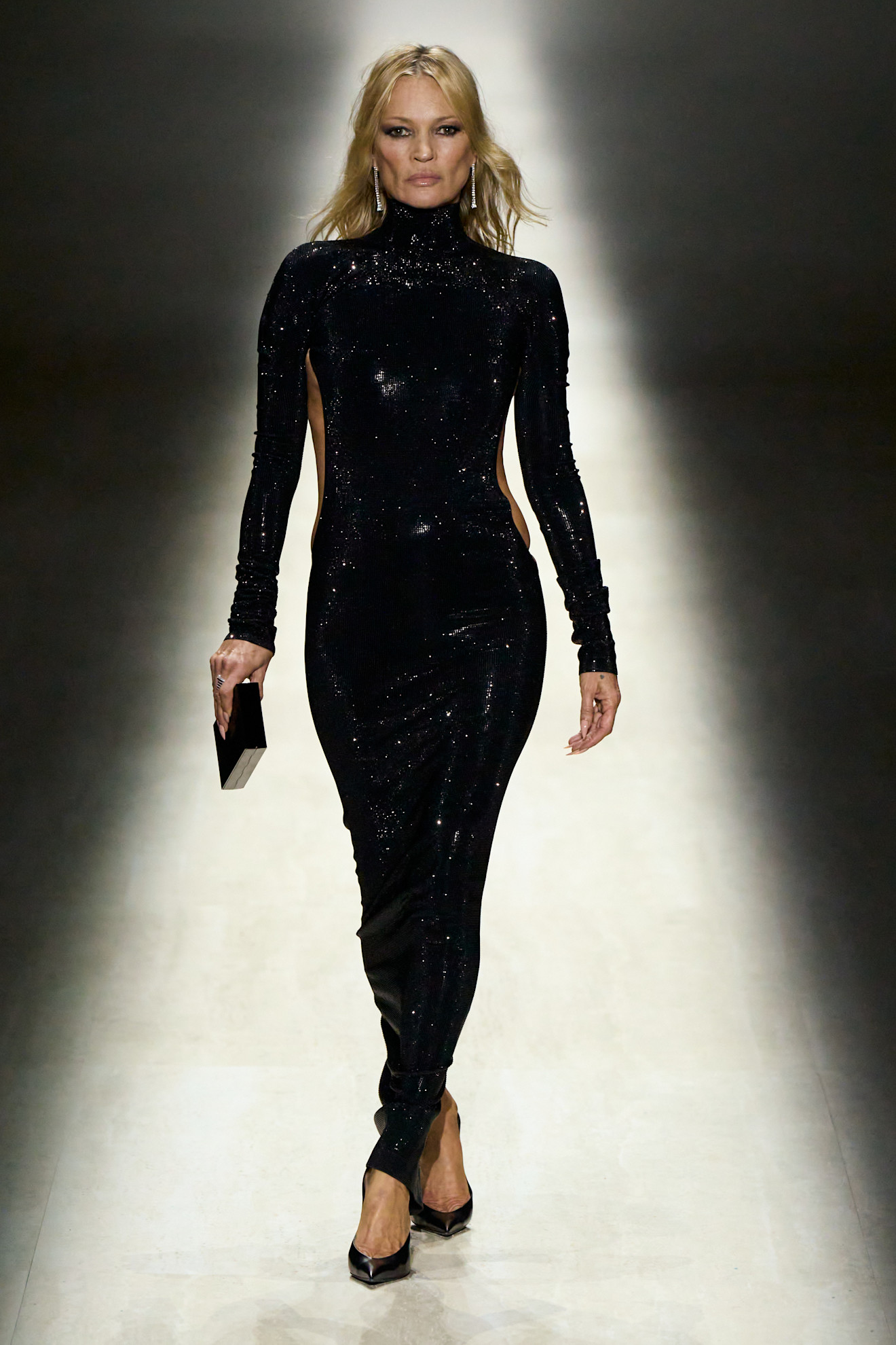Kate Moss walks the Gucci fall/winter 2026 runway during Milan Fashion Week wearing a black sequin gown