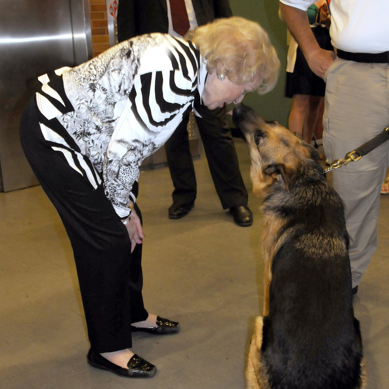 Betty White gets a kiss from police dog Magnum backstage at Good Morning America