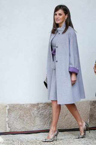 Queen Letizia wearing a grey coat and dress